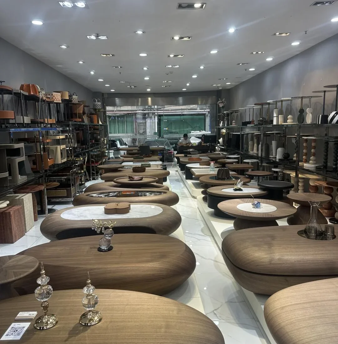 Dense occasional-table display in a merchant unit at Sunlink Furniture City South Section