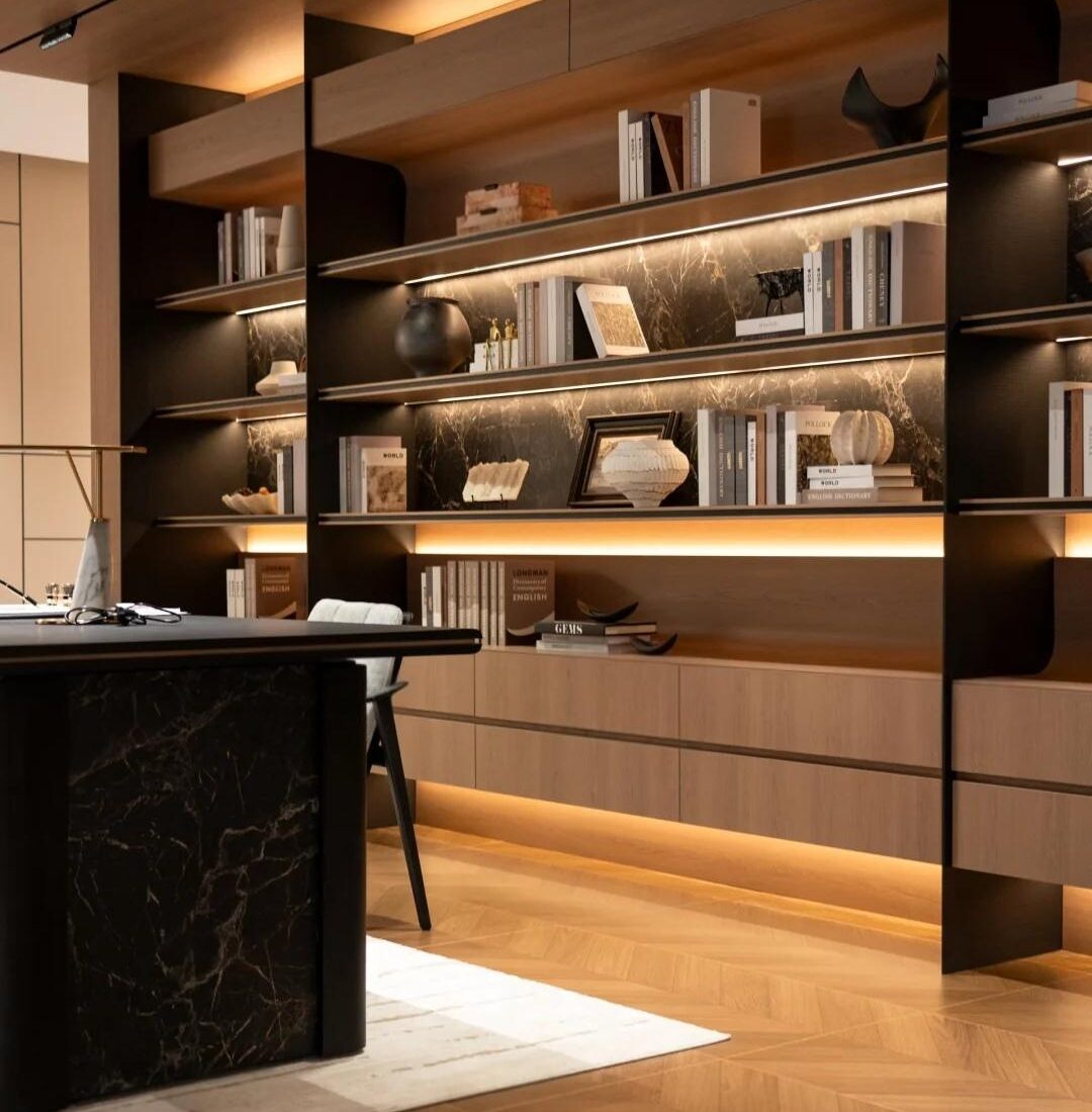 Warm timber display wall and meeting table inside the HENNISSY Foshan headquarters showroom